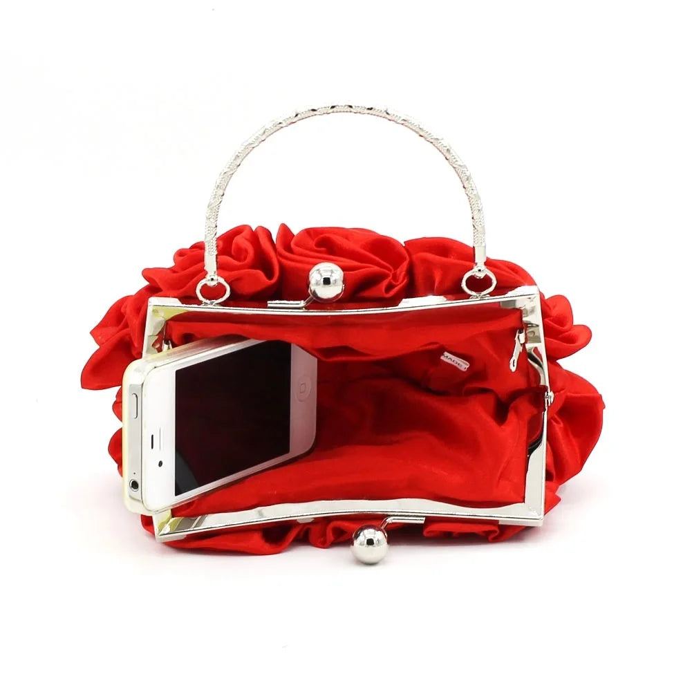 Minaudière rígida con detalle floral y cadena