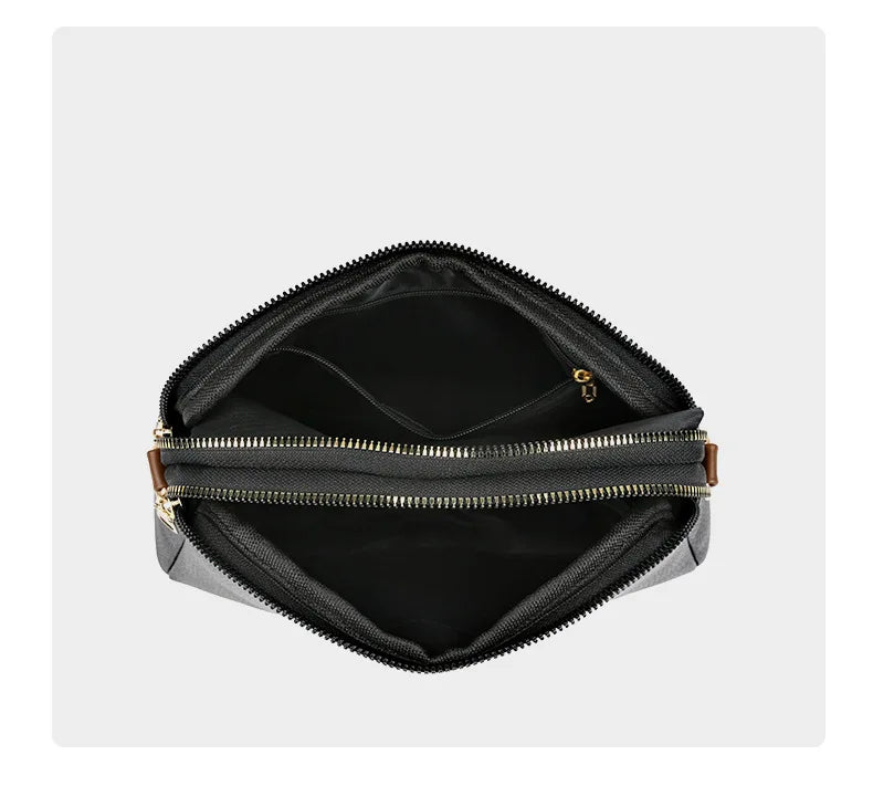 Bandolera negra de cuero con silueta curva