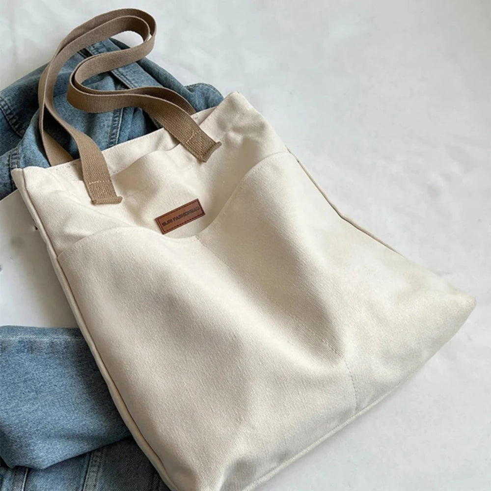 Bolso tote abierto de lona con bolsillo exterior