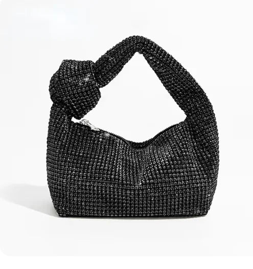 Cartera de fiesta con brillos y asa anudada