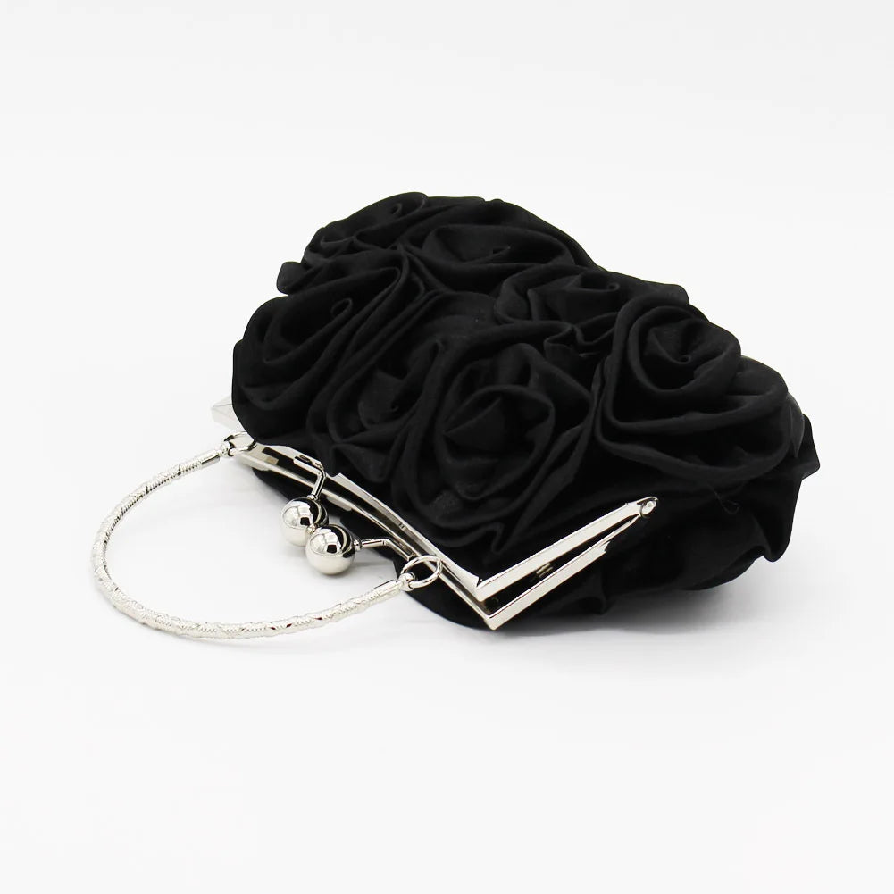 Minaudière rígida con detalle floral y cadena