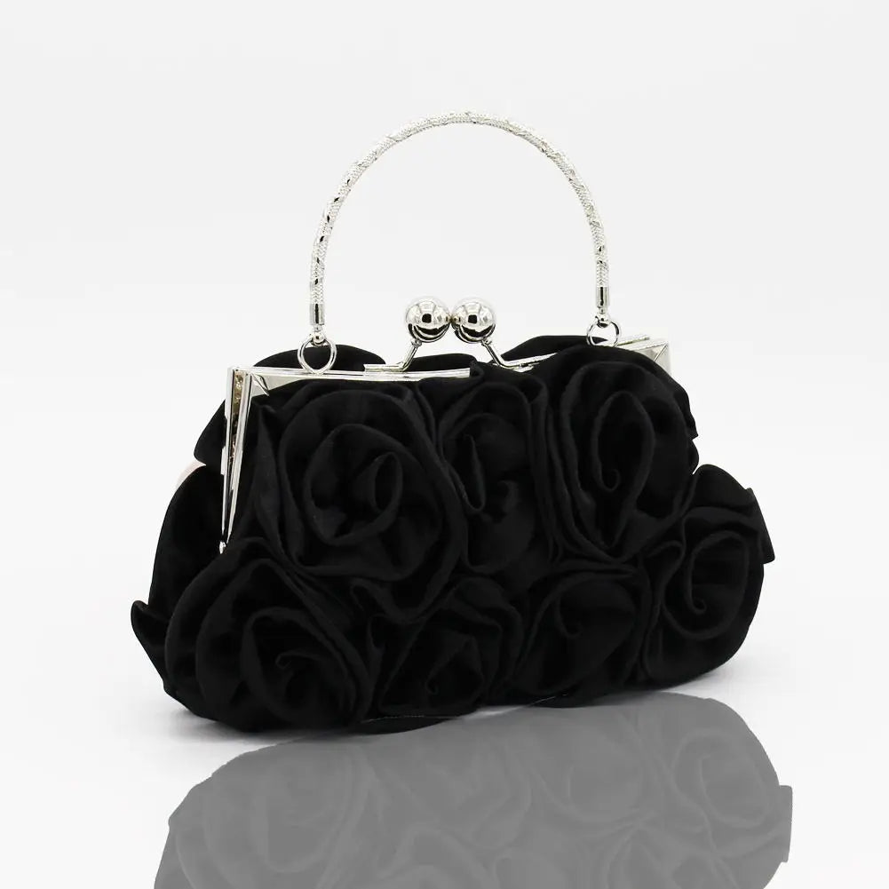 Minaudière rígida con detalle floral y cadena