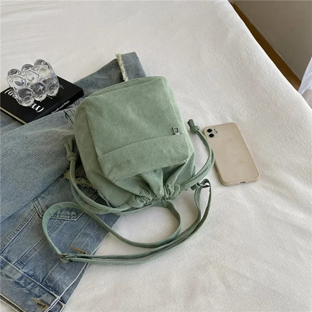 Cartera de corderoy con bolsillo interior con cierre