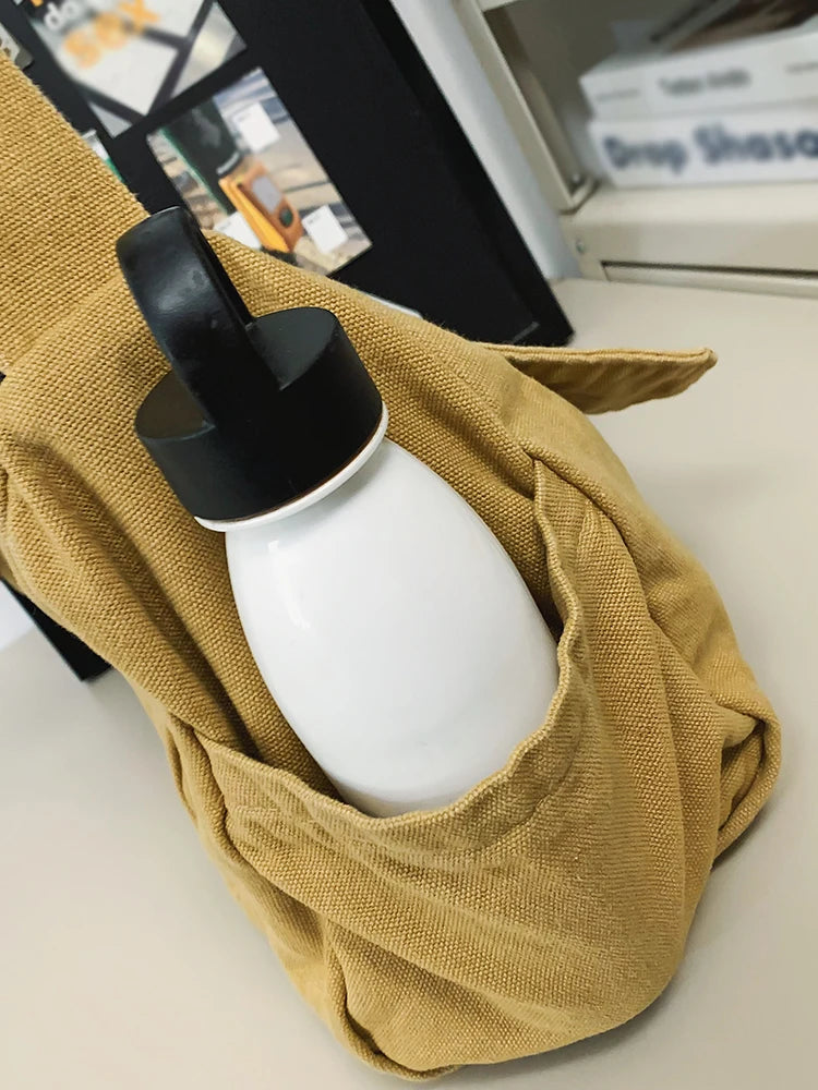 Bandolera de lona con solapa y bolsillo para celular