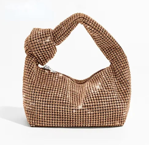 Cartera de fiesta con brillos y asa anudada