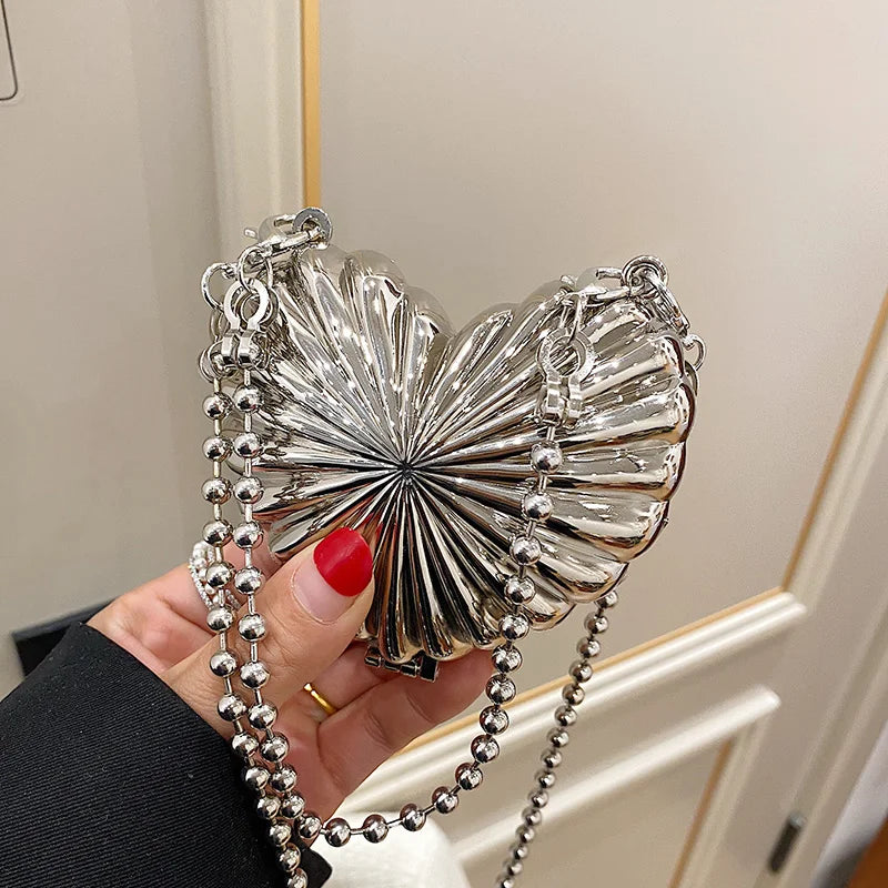 Minaudière metálica mini con cadena cruzada