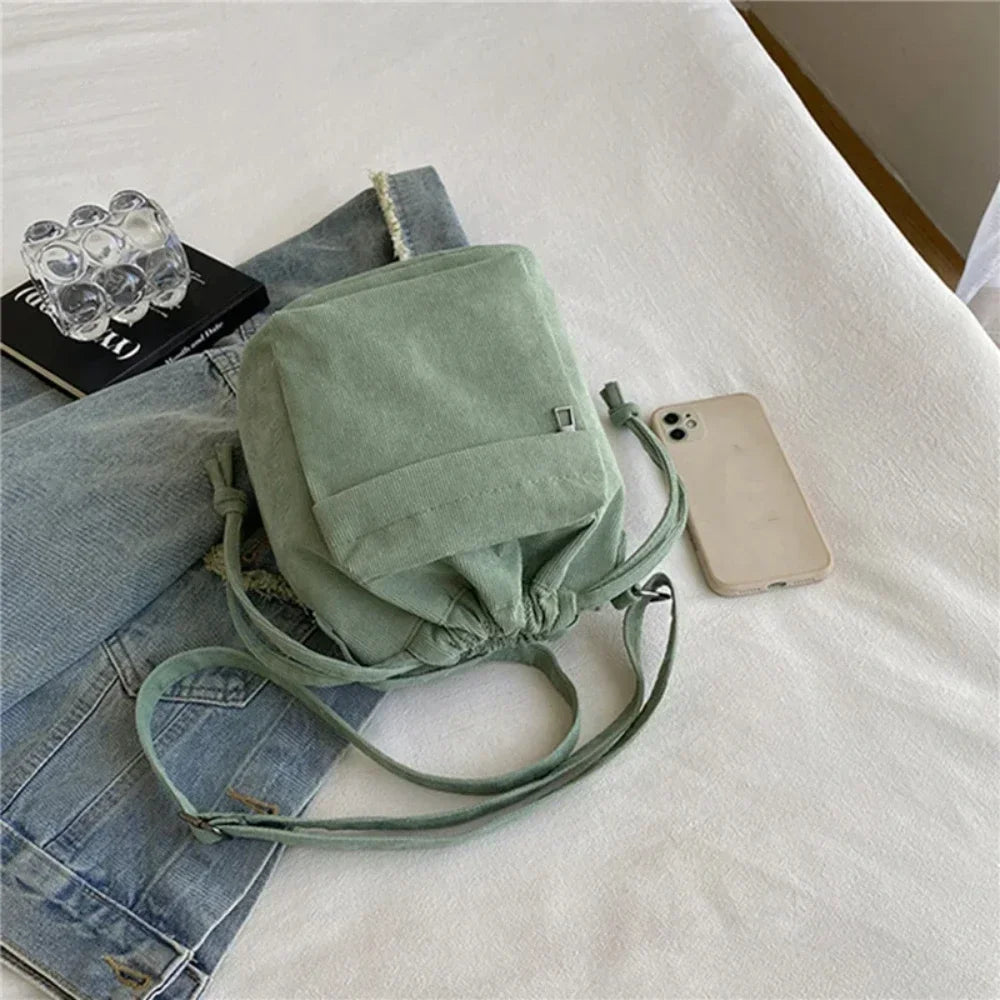 Cartera de corderoy con bolsillo interior con cierre