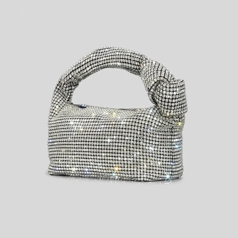 Cartera de fiesta con brillos y asa anudada