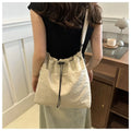 Cartera balde de nylon con cordón y dije opcional