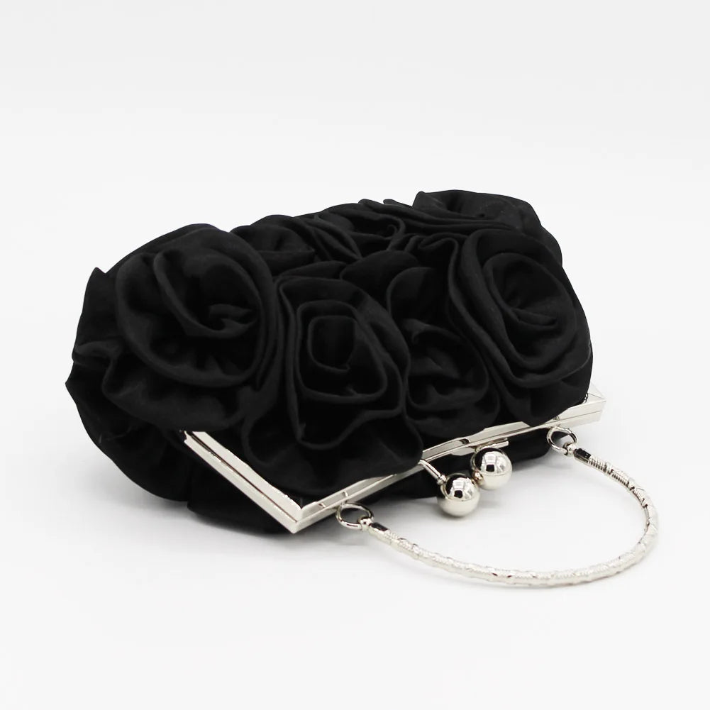 Minaudière rígida con detalle floral y cadena