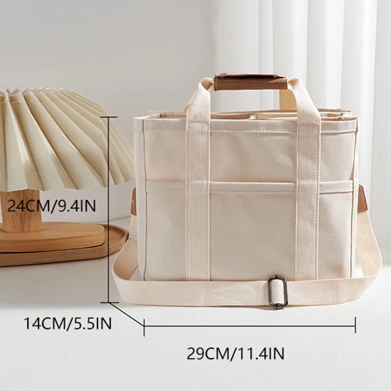 Bolso tote de lona con múltiples bolsillos y correa regulable
