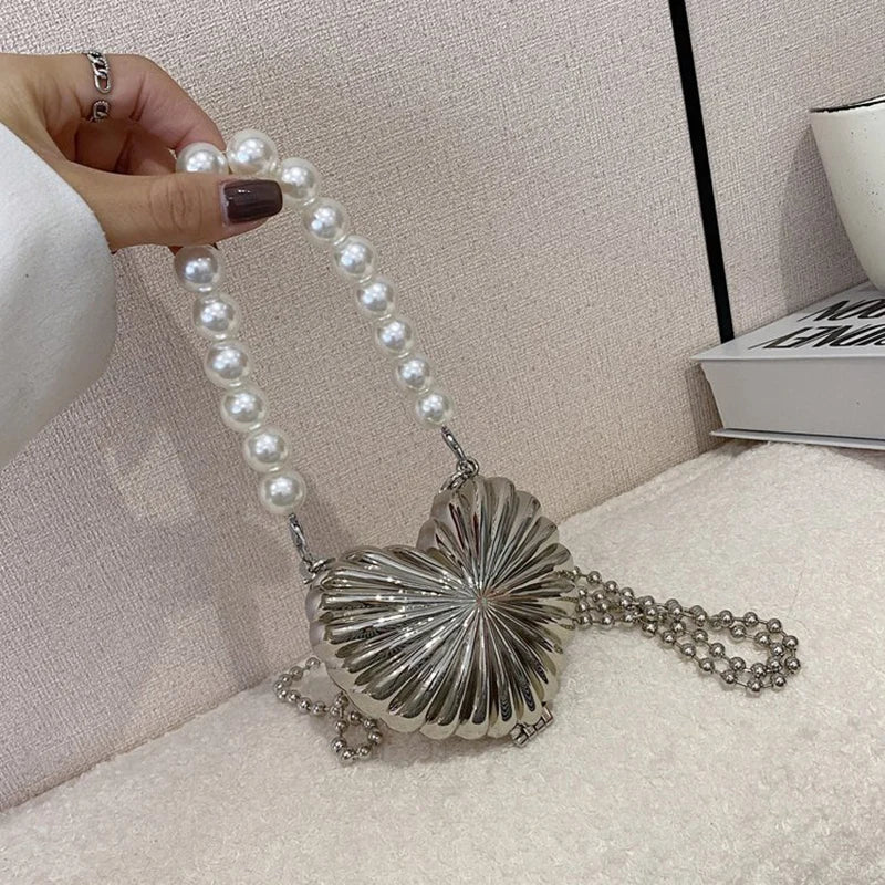 Minaudière metálica mini con cadena cruzada
