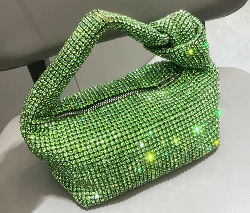 Cartera de fiesta con brillos y asa anudada
