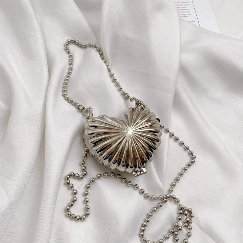 Minaudière metálica mini con cadena cruzada