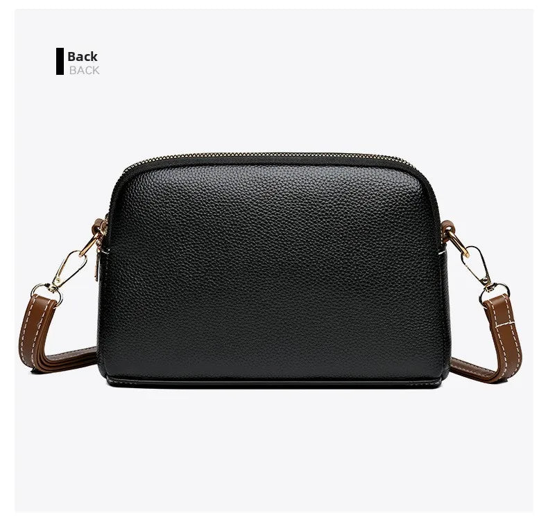 Bandolera negra de cuero con silueta curva