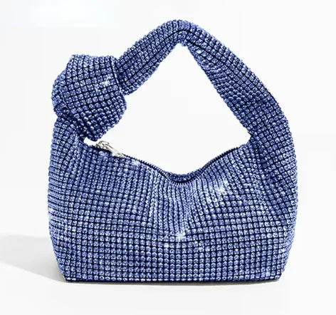 Cartera de fiesta con brillos y asa anudada
