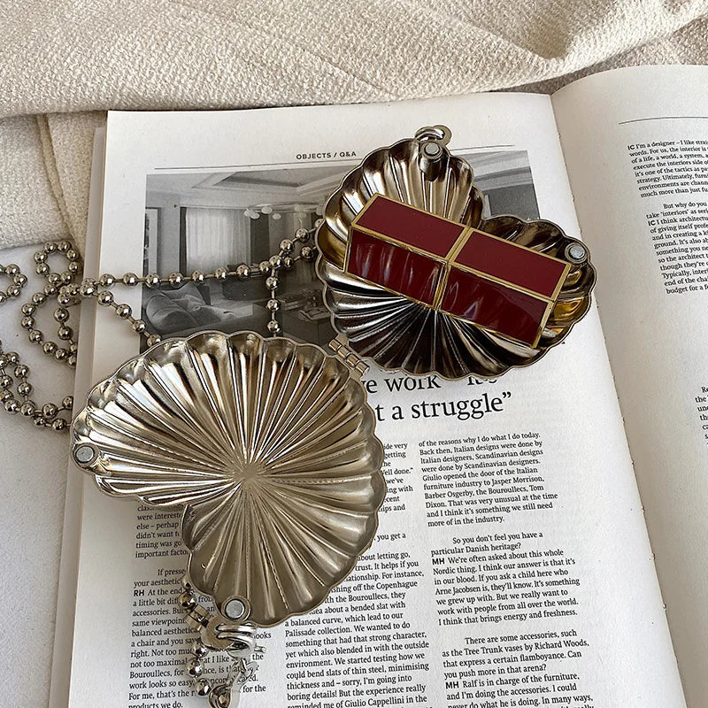 Minaudière metálica mini con cadena cruzada