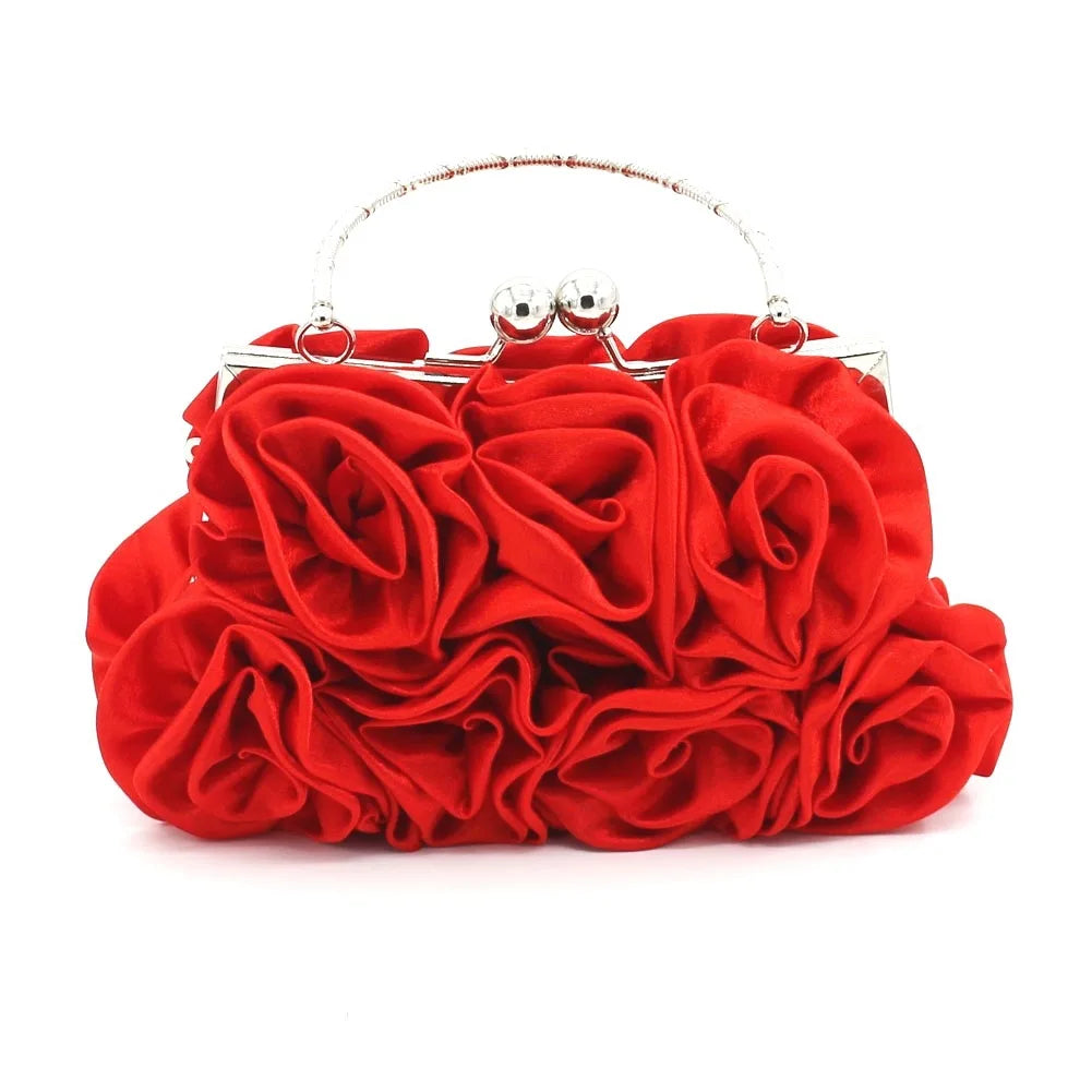 Minaudière rígida con detalle floral y cadena