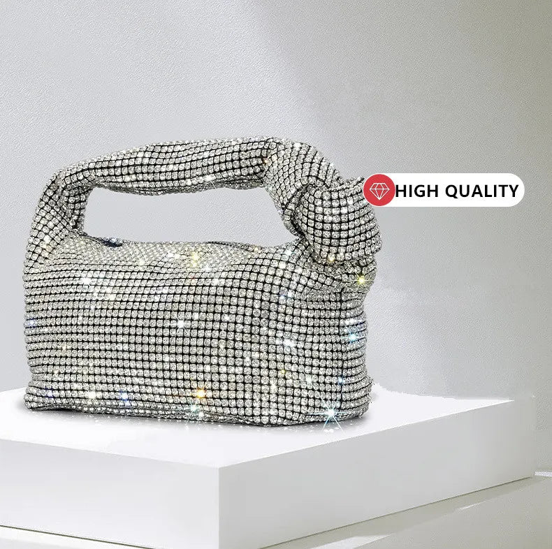 Cartera de fiesta con brillos y asa anudada