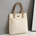 Bolso tote abierto de lona con bolsillo exterior