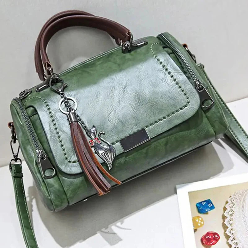 Cartera Boston con borla y correa desmontable
